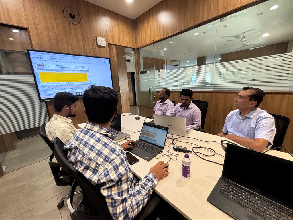 Hybrowlabs team reviewing an ERPNext project in a meeting room